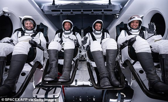 This undated photo courtesy of SpaceX shows Polaris Dawn astronauts Anna Menon (L), Scott "Kidd" Poteet (2L), Jared Isaacman (2R) and Sarah Gillis (R), sit inside the Polaris Dawn Crew Dragon Resilience ahead of a now postponed launch in Cape Canaveral, Florida. The Polaris Dawn launch has already been postponed twice the week of August 27, first due to a technical issue with the ground-based rocket tower and then because of forecasted weather conditions at the planned splashdown site. (Photo by SPACEX / AFP) / RESTRICTED TO EDITORIAL USE - MANDATORY CREDIT "AFP PHOTO / HANDOUT / SPACEX " - NO MARKETING NO ADVERTISING CAMPAIGNS - DISTRIBUTED AS A SERVICE TO CLIENTS (Photo by -/SPACEX/AFP via Getty Images)