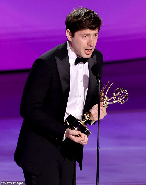 LOS ANGELES, CALIFORNIA - SEPTEMBER 15: Alex Edelman accepts the Outstanding Writing for a Variety Special award for "Just for Us â¿" Alex Edelman" onstage during the 76th Primetime Emmy Awards at Peacock Theater on September 15, 2024 in Los Angeles, California.  (Photo by Kevin Winter/Getty Images)