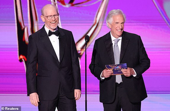 Presenters Ron Howard and Henry Winkler speak on stage at the 76th Primetime Emmy Awards in Los Angeles, California, U.S., September 15, 2024. REUTERS/Mario Anzuoni